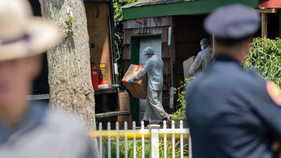 PHOTO: Crime laboratory officers removes boxes as law enforcement searches the home of Rex Heuermann, Saturday, July 15, 2023, in Massapequa Park, N.Y. (Jeenah Moom/AP)