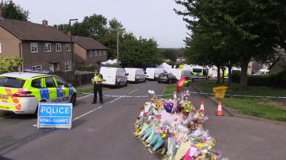 Flowers near to the scene in Chandos Crescent, Killamarsh, near Sheffield, where the bodies of John Paul Bennett, 13, Lacey Bennett, 11, their mother Terri Harris, 35, and Lacey�s friend Connie Gent, 11, were discovered at a property on Sunday morning. Picture date: Tuesday September 21, 2021.