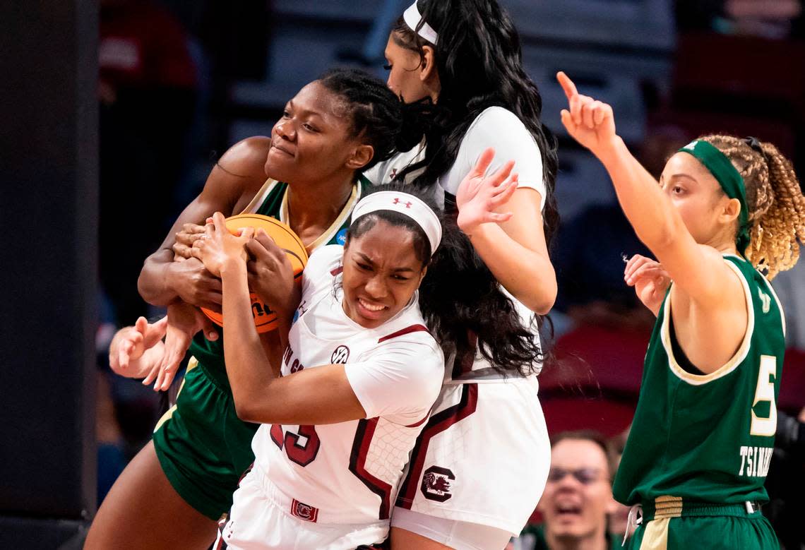 South Carolina guard Bree Hall (23) battles for a loose ball with South Florida forward Dulcy Fankam Mendjiadeu (32) during Sunday’s NCAA Tournament game at Colonial Life Arena in Columbia on Sunday, March 19, 2023.