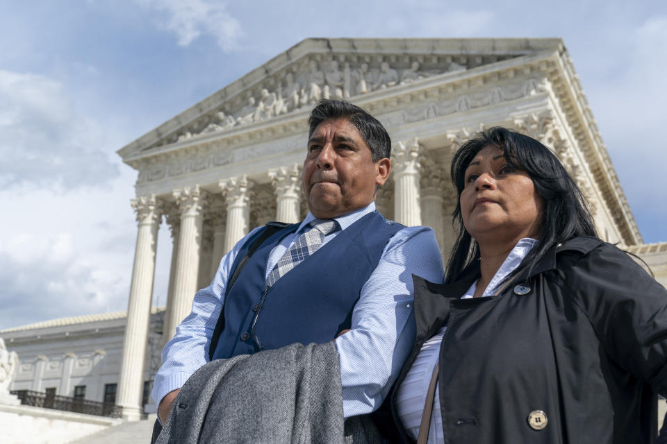 Beatriz Gonzalez, right, the mother of 23-year-old Nohemi Gonzalez, a student killed in the Paris terrorist attacks, and stepfather Jose Hernandez, speak outside the Supreme Court,Tuesday, Feb. 21, 2023, in Washington. A lawsuit against YouTube from the family of Nohemi Gonzalez was argued at the Supreme Court. (AP Photo/Alex Brandon)