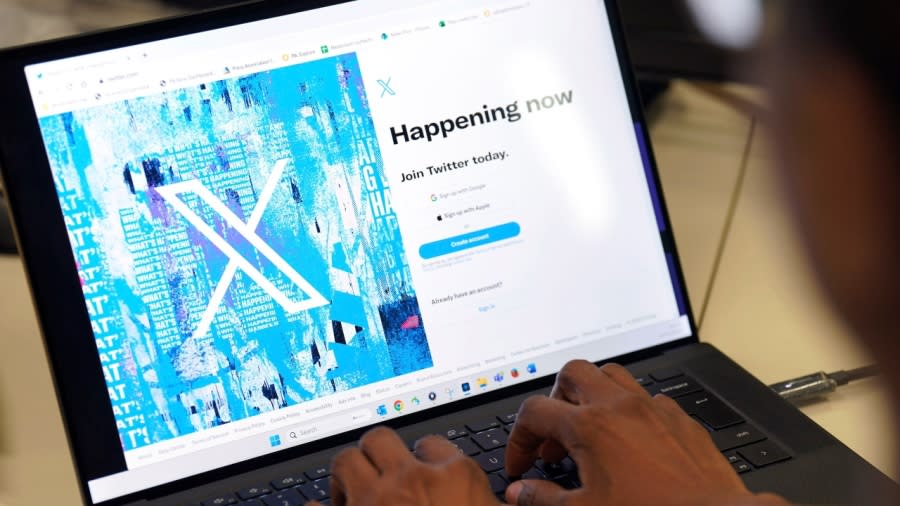 A person signs into the Twitter website, which is now displaying the new logo, in an office in central London Monday. Elon Musk has unveiled a new “X” logo to replace Twitter’s famous blue bird as he follows through with a major rebranding of the the social media platform he bought for $44 billion last year. Musk had asked fans for logo ideas and chose one, which he described as minimalist Art Deco, saying it “certainly will be refined.” (Photo: Jonathan Brady/PA via AP)
