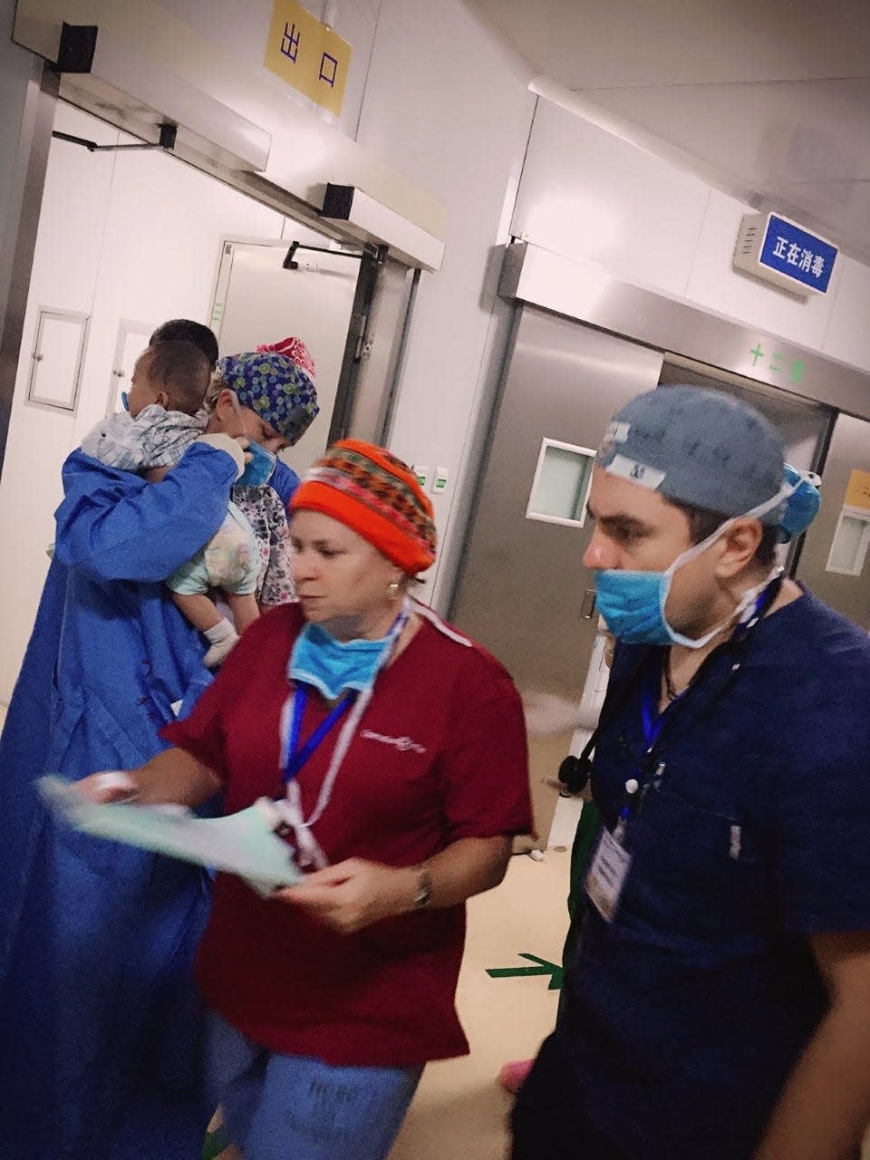 Claire Donaghy (center), an Operation Smile volunteer from New Jersey, has been a clinical coordinator for charity surgical teams for more than a decade.