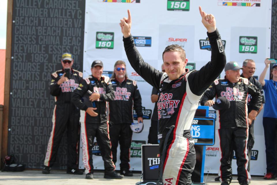 Parker Kligerman celebrates after winning the NASCAR Camping Truck Series O’Reilly Auto Parts 150 race at Mid-Ohio.