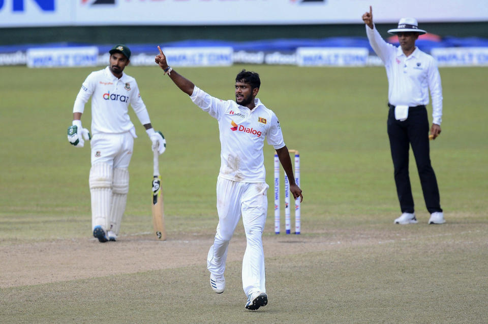 Sri Lanka bowler Ramesh Mendis, center, celebrates after dismissal of Bangladeshi batsman Mushfiqur Rahim during the fourth day of the second test cricket match between Sri Lanka and Bangladesh in Pallekele, Sri Lanka, Sunday, May 02, 2021.( AP Photo/Sameera Peiris)