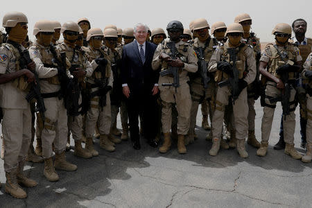 U.S. Secretary of State Rex Tillerson poses for pictures with Chadian Special Program for Embassy Augmentation and Response (SPEAR) security personnel as he departs N'Djamena, Chad, March 12, 2018. REUTERS/Jonathan Ernst