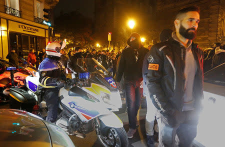 Police officers gather during an unauthorised protest against anti-police violence in front of the Police Prefecture in Paris, France, October 21, 2016. REUTERS/Jacky Naegelen