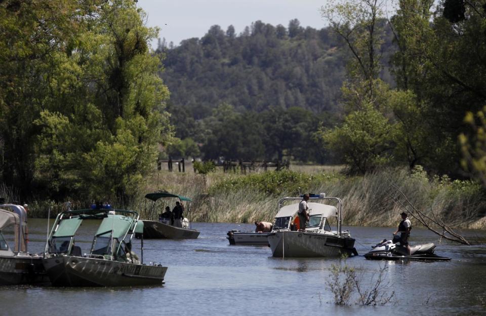Law enforcement agencies use boats and divers to search Cache Creek for missing 9-year-old autistic girl Mikaela Renee Lynch behind her home in Clearlake, Calif. on Monday, May 13, 2013. Her body was found in the creek Wednesday, May 15, 2013. (AP Photo/The Press Democrat, Beth Schlanker)