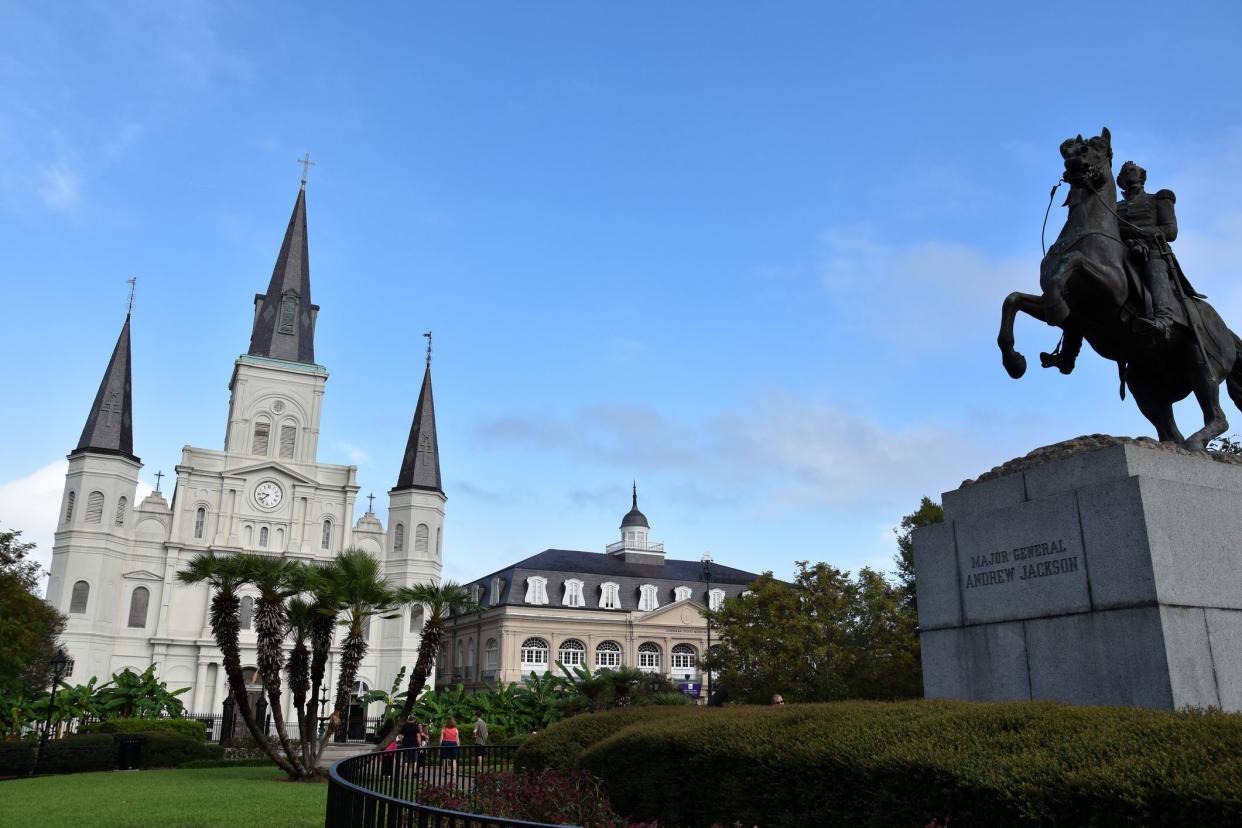 New Orleans, Louisiana, USA - October 9, 2018: Jackson Square in the French Quarter, with St. Louis Cathedral, the Presbytère and the equestrian statue of Andrew Jackson.