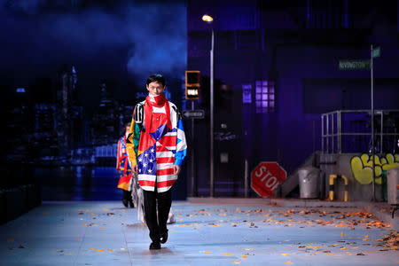 A model presents a creation by designer Virgil Abloh during a preview show for his Fall/Winter 2019-2020 collection for fashion house Louis Vuitton during Men's Fashion Week in Paris, France, January 17, 2019. REUTERS/Gonzalo Fuentes