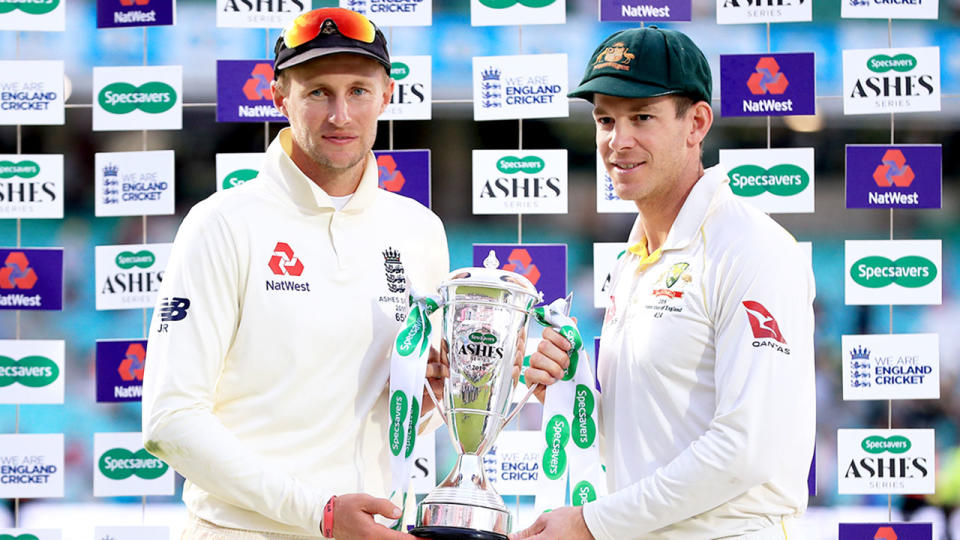 Pictured here, England captain Joe Root and Aussie counterpart Tim Paine pose with the Ashes trophy.