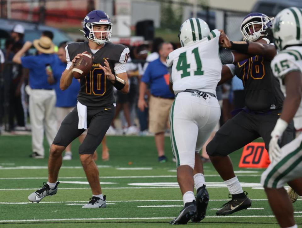 Northwestern High School quarterback Finley Polk looks for an opening Friday, Aug. 11, 2023 at District Three Stadium in Rock Hill, S.C.