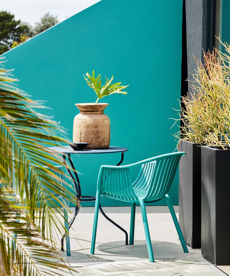 Little Greene paint on patio with blue wall and chair