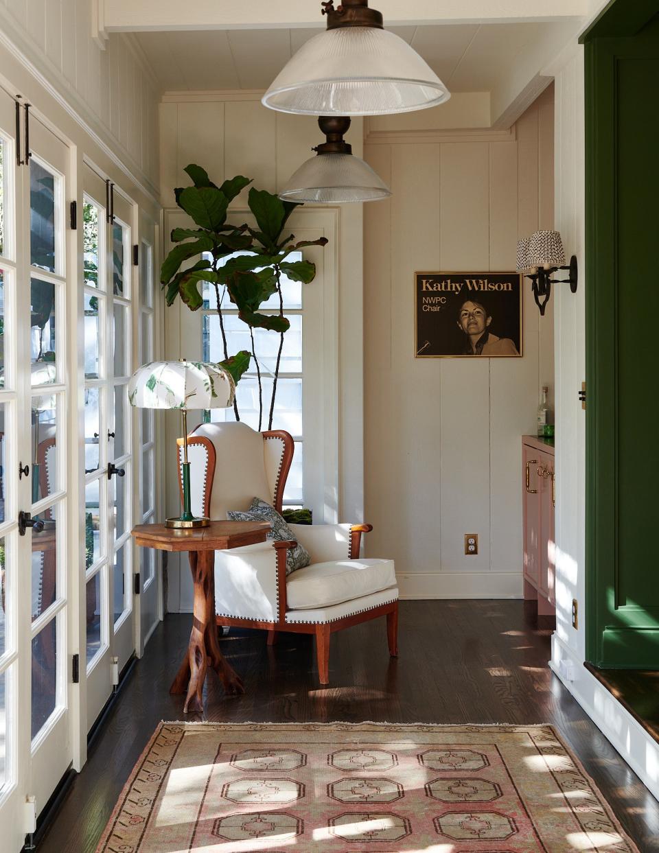 A sunny pass through between the dining room and the verandah was made cozy with the addition of an armchair from Lief and a vintage rug from Jamal’s Rugs. The side table is a vintage piece from Nickey Kehoe and the lamp is Joseph Frank from Lief.