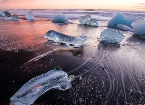 The icebergs of Jokulsarlon beach - Credit: AP