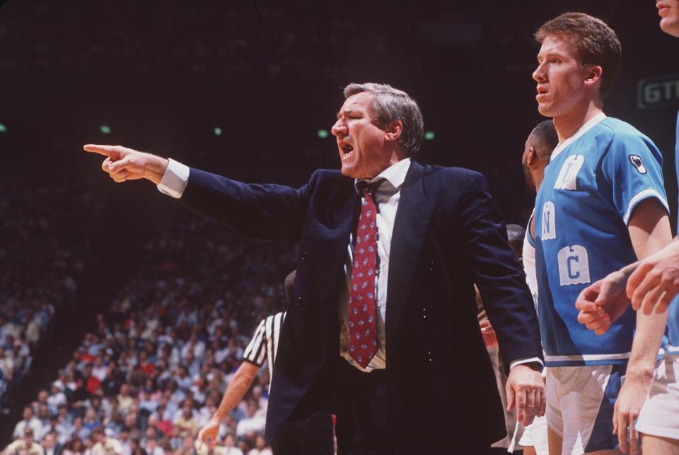 1989: AN ANIMATED NORTH CAROLINA HEAD COACH DEAN SMITH DIRECTS THE OFFENSE FROM THE SIDELINE DURING A TARHEELS REGULAR SEASON GAME AT THE SMITH CENTER IN CHAPEL HILL, NORTH CAROLINA. Mandatory Credit: Allsport/ALLSPORT