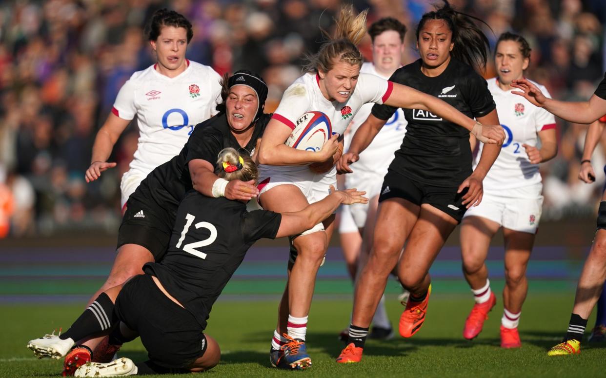 Zoe Aldcroft (right) is tackled by New Zealand's Chelsea Alley (12) and Aleisha Nelson during the Women's Autumn International match at Sandy Park, Exeter. Picture date: Sunday October 31, 2021. - PA