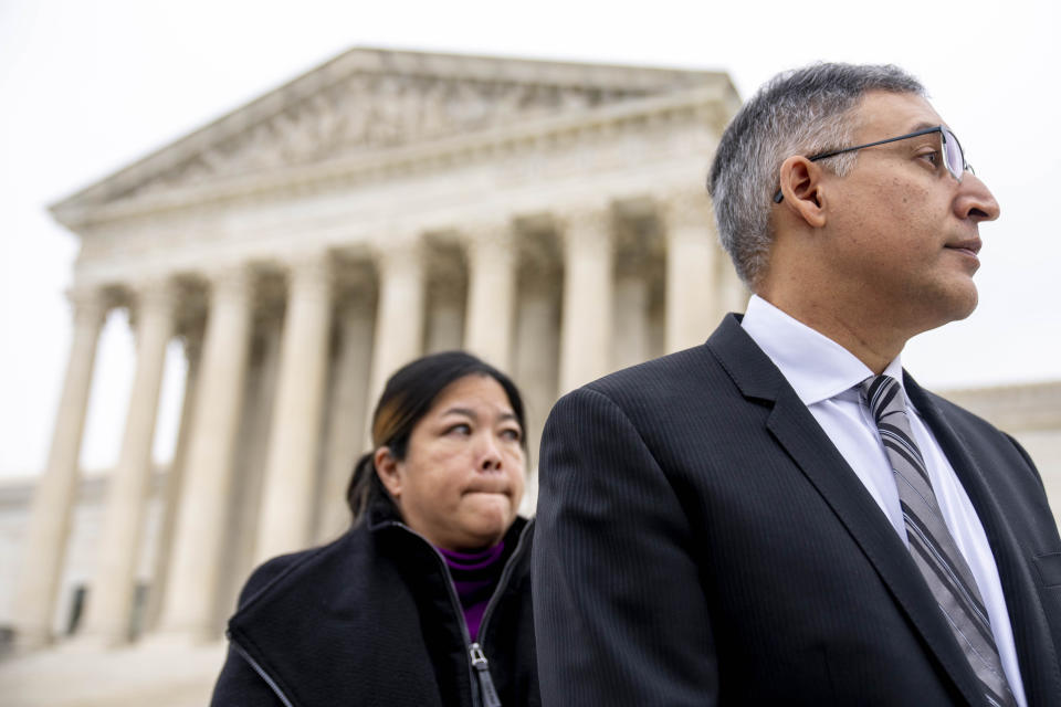 Common Cause National Redistricting Director Kathay Feng, and attorney Neal Katyal take a question from a reporter in front of the Supreme Court in Washington, Wednesday, Dec. 7, 2022, as the Court hears arguments on a new elections case that could dramatically alter voting in 2024 and beyond. The case is from highly competitive North Carolina, where Republican efforts to draw congressional districts heavily in their favor were blocked by a Democratic majority on the state Supreme Court. (AP Photo/Andrew Harnik)