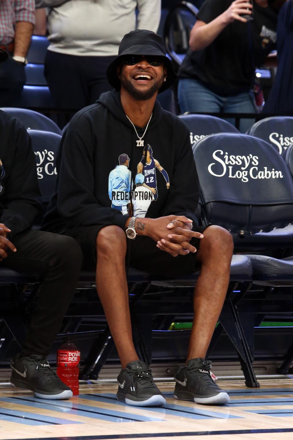 Tee Morant watches as his son, Memphis Grizzlies guard Ja Morant (not pictured) shoots during warm ups prior to the game against the Houston Rockets at FedExForum. Morant wears a “Redemption” sweatshirt.