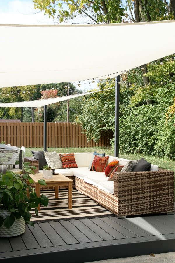 beige shade sail over back patio