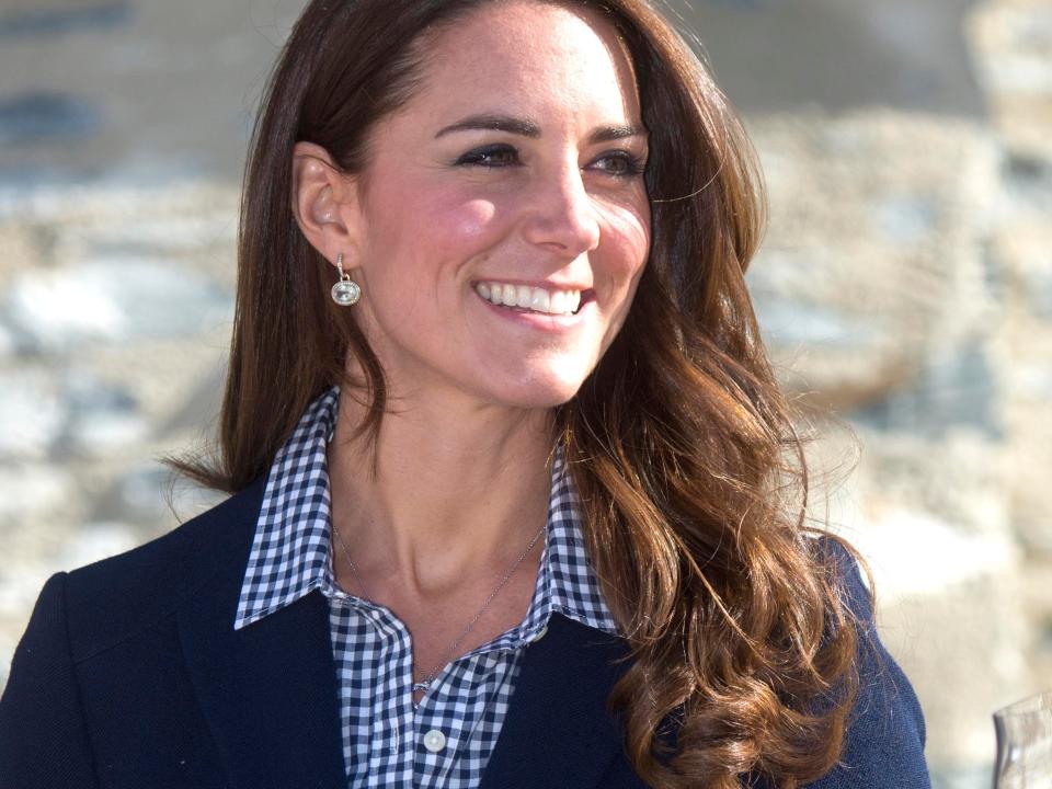 Kate Middleton visiting New Zealand in a navy blazer.