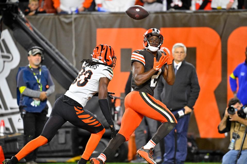 Cleveland Browns wide receiver Amari Cooper (2) catches a pass from quarterback Jacoby Brissett for a touchdown with Cincinnati Bengals cornerback Tre Flowers (33) defending during the second half of an NFL football game in Cleveland, Monday, Oct. 31, 2022. (AP Photo/David Richard)