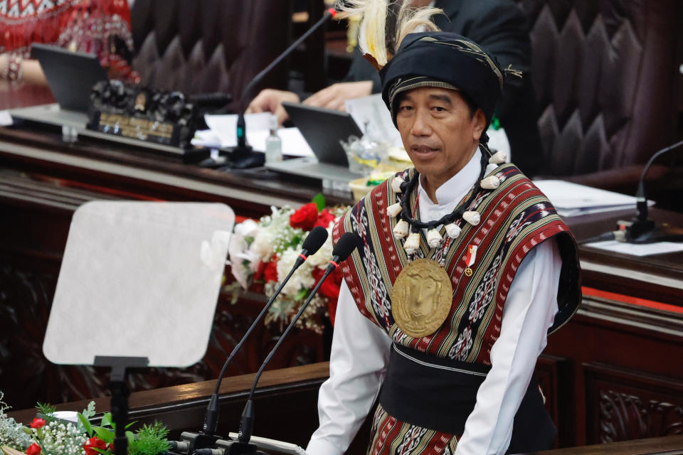 Indonesian President Joko Widodo, wearing traditional attire from Tanimbar Islands of Maluku province, delivers his State of the Nation Address ahead of the country's Independence Day, at the parliament building in Jakarta, Indonesia, Wednesday, Aug. 16, 2023. (Willy Kurniawan/Pool Photo via AP)