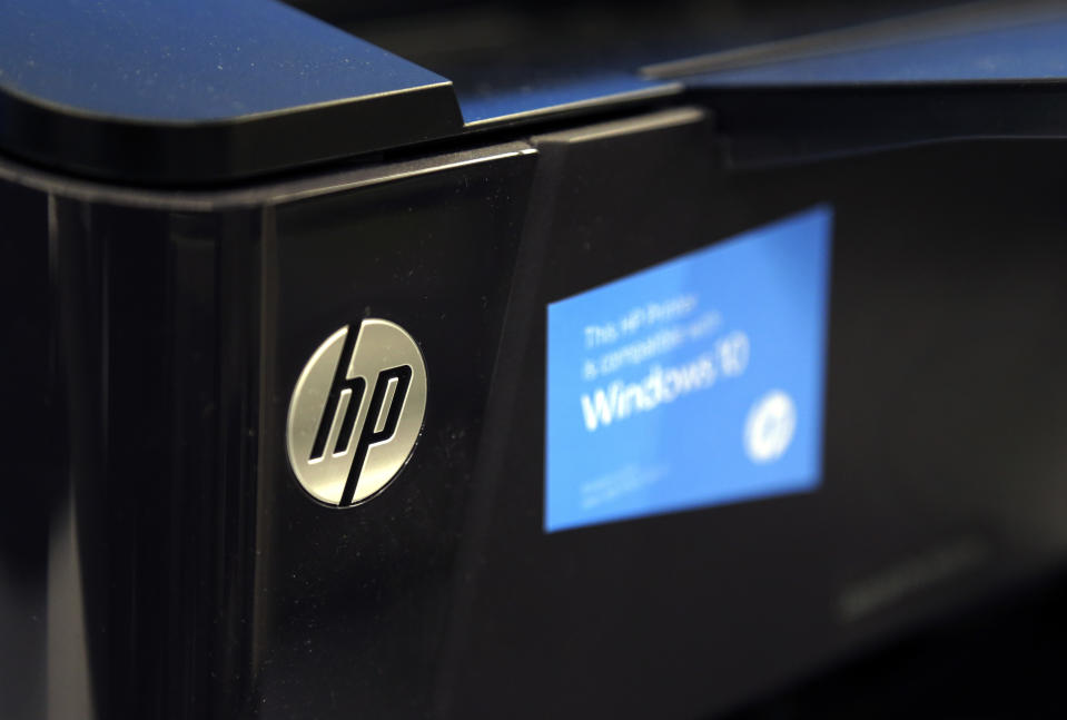 FILE - This May 24, 2016, file photo shows an HP printer on display at a store, in North Andover, Mass. HP Inc. reports financial results Thursday, Feb. 22, 2018. (AP Photo/Elise Amendola, File)