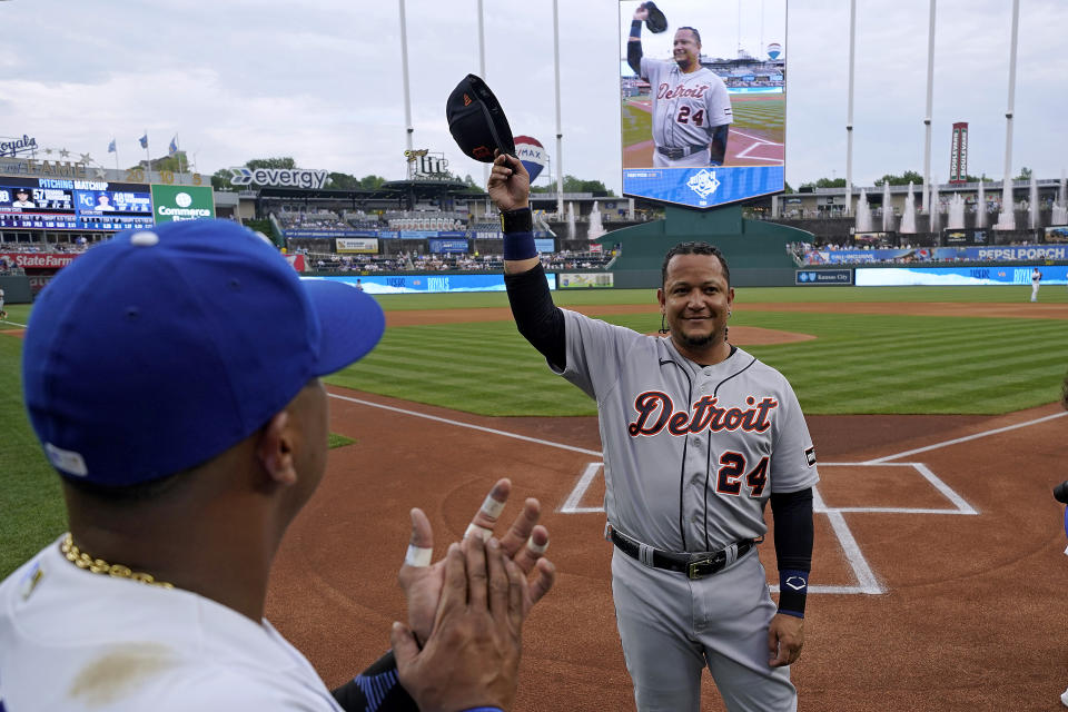 Kansas City Royals' Salvador Perez, left, applauds for Detroit Tigers' Miguel Cabrera (24) as Cabrera is honored before a baseball game Wednesday, July 19, 2023, in Kansas City, Mo. (AP Photo/Charlie Riedel)