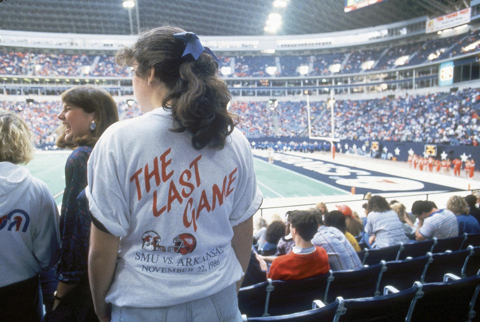 A fan wears a T-shirt calling out SMU's last game before its program was disbanded. (Photo by Phil Huber /Sports Illustrated via Getty Images) 