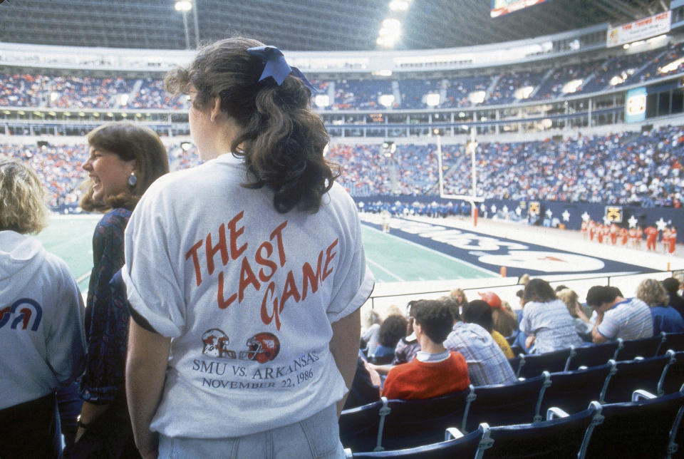 An SMU fan wears a T-shirt commemorating 