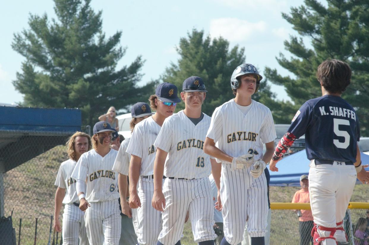 Gaylord shakes hands with Southern West Little League after falling in the Michigan Senior Baseball state championship game.