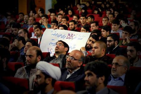 A man holds an anti-B.B.C. sign during a conservatives campaign gathering for the upcoming parliamentary elections and the upcoming vote on the Assembly of Experts, in Tehran February 24, 2016. The campaign gathering was titled "No to UK Meddling". REUTERS/Raheb Homavandi/TIMA