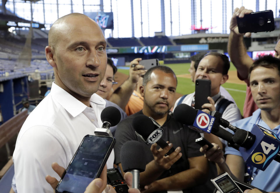 FILE - In this May 3, 2019, file photo, Miami Marlins CEO Derek Jeter talks with reporters before a baseball game against the Atlanta Bravesin Miami. Marlins CEO Derek Jeter told team employees during a conference call Monday, April 20, 2020, he is forgoing his salary during the coronavirus pandemic, a person familiar with the discussions told The Associated Press. The person confirmed Jeter's comments to the AP on condition of anonymity because the Marlins have not commented publicly on the call. (AP Photo/Lynne Sladky, File)