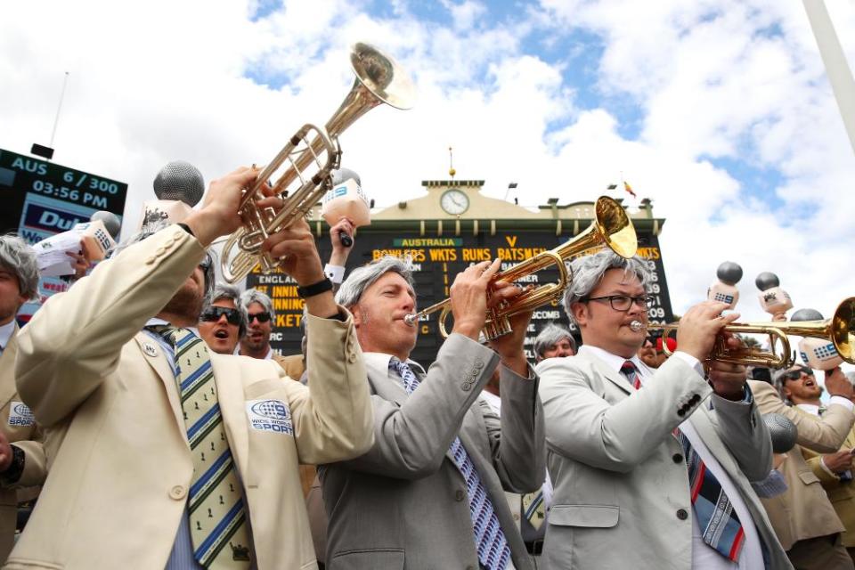 Fans dressed as the late Richie Benaud