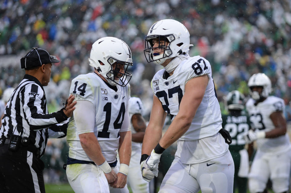 EAST LANSING, MI - OCTOBER 26: Penn State tight end Pat Freiermuth (87) and quarterback Sean Clifford (14) celebrate Freiermuth's second quarter touchdown during a college football game between the Michigan State Spartans and Penn State Nittany Lions on October 26, 2019 at Spartan Stadium in East Lansing, MI. (Photo by Adam Ruff/Icon Sportswire via Getty Images)