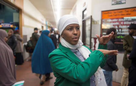 Farhio Khalif, an advocate for East African and Muslim women, talks with a reporter at Karmel Square Somali Mall ahead of the NFL's Super Bowl in Minneapolis, Minnesota, U.S. January 20, 2018. REUTERS/Craig Lassig/Files