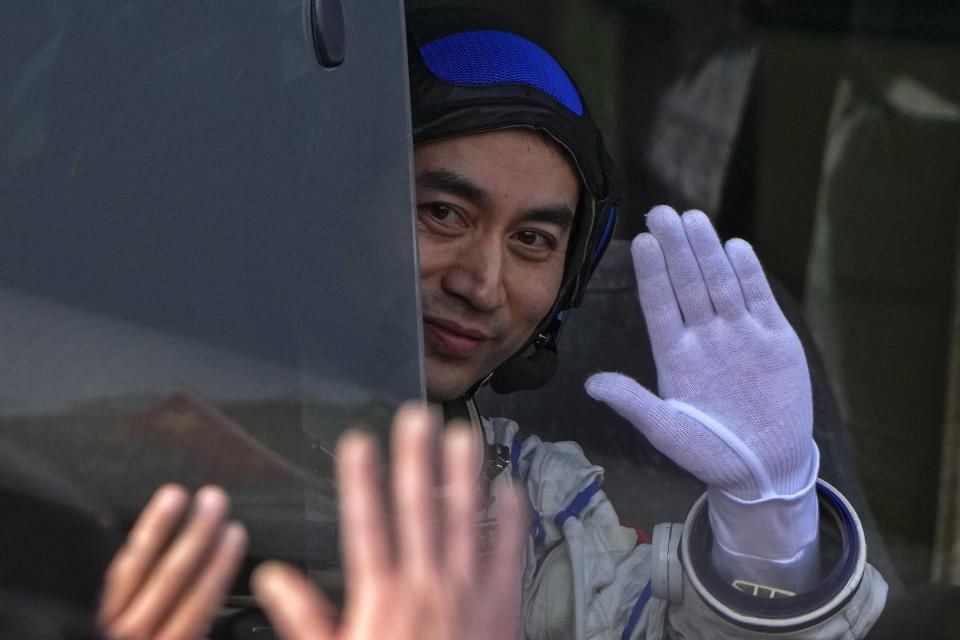 Chinese astronaut for the Shenzhou-18 mission Ye Guangfu waves from a vehicle during a send-off ceremony for their manned space mission at the Jiuquan Satellite Launch Center in northwestern China, Thursday, April 25, 2024. (AP Photo/Andy Wong)