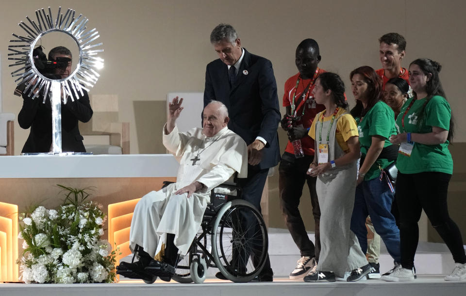 Pope Francis waves to the crowd during the 37th World Youth Day flock at the Parque Tejo in Lisbon, Saturday, Aug. 5, 2023. On Sunday morning, the last day of his five-day trip to Portugal, Francis is to preside over a final, outdoor Mass on World Youth Day – when temperatures in Lisbon are expected to top 40 degrees C (104F) – before returning to the Vatican. (AP Photo/Armando Franca)