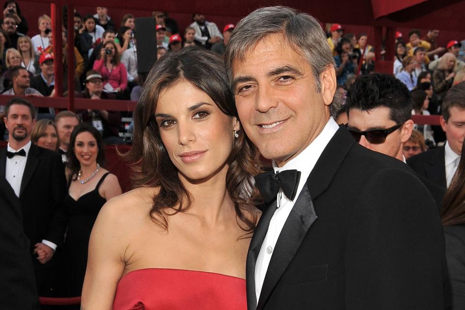 Actor George Clooney (R) and Elisabetta Canalis arrive at the 82nd Annual Academy Awards held at the Kodak Theatre on March 7, 2010 in Hollywood, California.