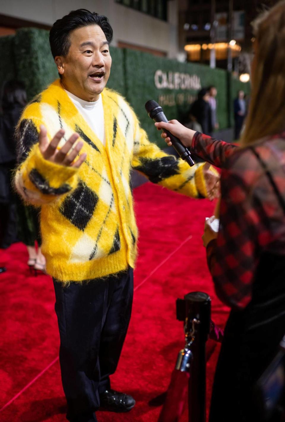 Chef Roy Choi, a restaurateur and show host known as one of the architects of the modern food truck movement, is interviewed on the red carpet before about being part of the 15th class of inductees to the California Hall of Fame on Tuesday, Dec. 13, 2022, before the induction ceremony at the California Museum in downtown Sacramento.