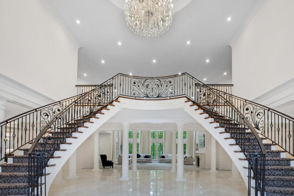Curved dual stairways add a dramatic touch to a Westerville-area home listed for $4.2 million.
