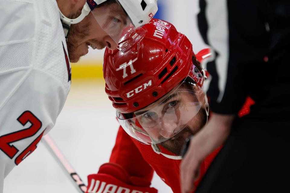 Capitals center Nic Dowd and Red Wings center Dylan Larkin face off in the second period on Tuesday, April 9, 2024, at Little Caesars Arena.