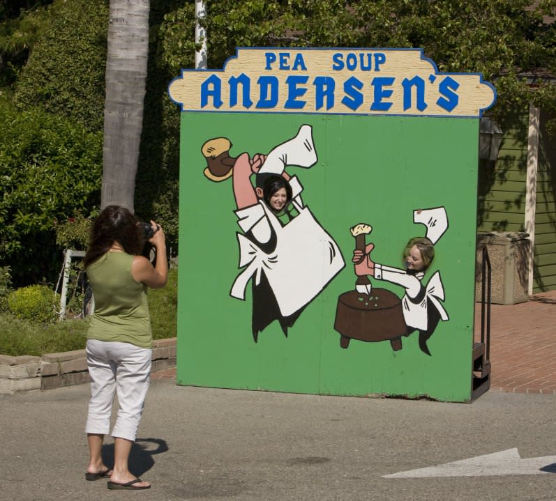 BUELLTON, SANTA YNEZ VALLEY, SANTA BARBARA COUNTY, CA – 2009: People have their picture taken in front of Andersen’s Splt Pea Soup Restaurant as seen in this 2009 Buellton, Santa Ynez Valley, Santa Barbara County, California, afternoon photo. (Photo by George Rose/Getty Images)