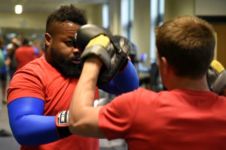 French centre Mathieu Bastareaud (L) takes part in an indoor training session at Vale Resort in Hensol on October 3, 2015, ahead of the Rugby World Cup match against Ireland