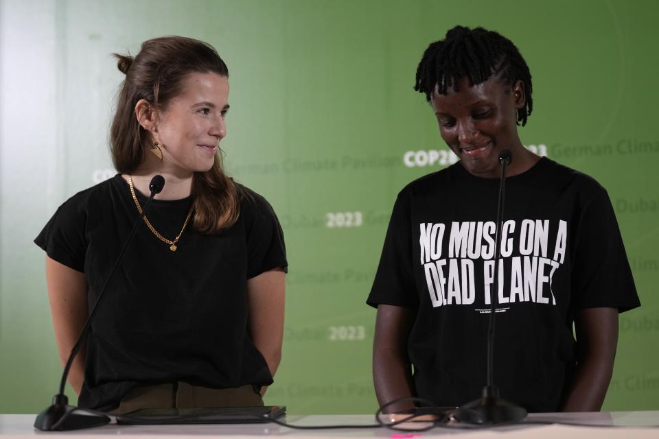 Luisa Neubauer, of Germany, left, and Vanessa Nakate, of Uganda, speak during a news conference at the COP28 U.N. Climate Summit, Wednesday, Dec. 6, 2023, in Dubai, United Arab Emirates. (AP Photo/Rafiq Maqbool)