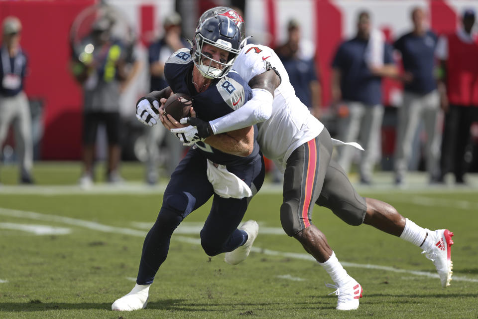 Tennessee Titans quarterback Will Levis (8) is sacked by Tampa Bay Buccaneers linebacker Shaquil Barrett, right, during the first half of an NFL football game Sunday, Nov. 12, 2023, in Tampa, Fla. (AP Photo/Mark LoMoglio)