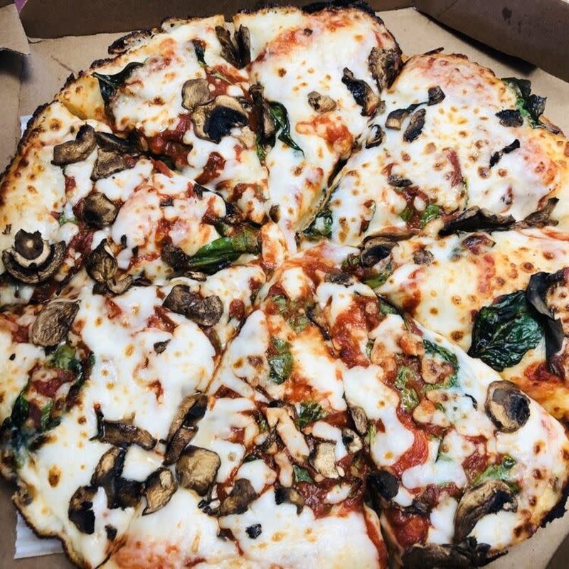 Focus on Spinach and Mushroom Domino's Pizza in a Pizza Box