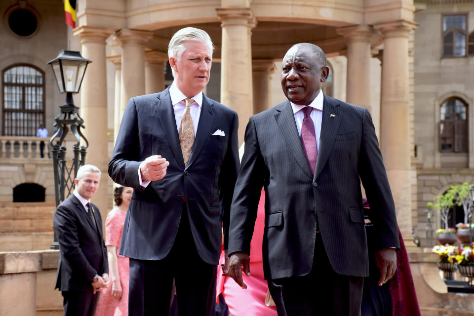 King Philippe of Belgium, left, is welcomed by South African President Cyril Ramaphosa in Pretoria, South Africa, Thursday, March 23, 2023. The King and Queen Mathilde are on a four-day state visit to South Africa. (AP Photo/Frans Sello waga Machat)