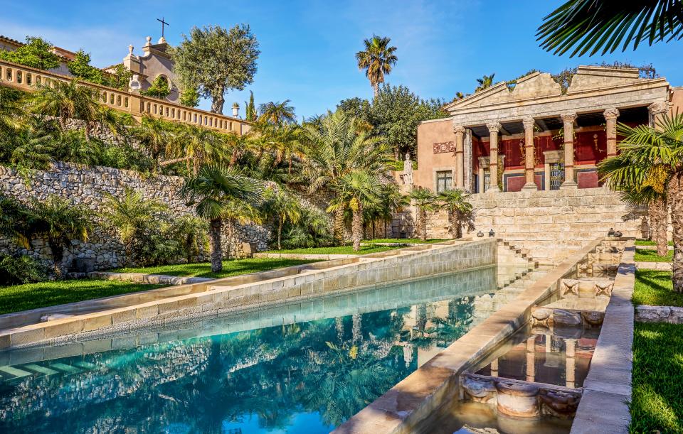 The chapel (left) and temple overlook the palm-edged pool.