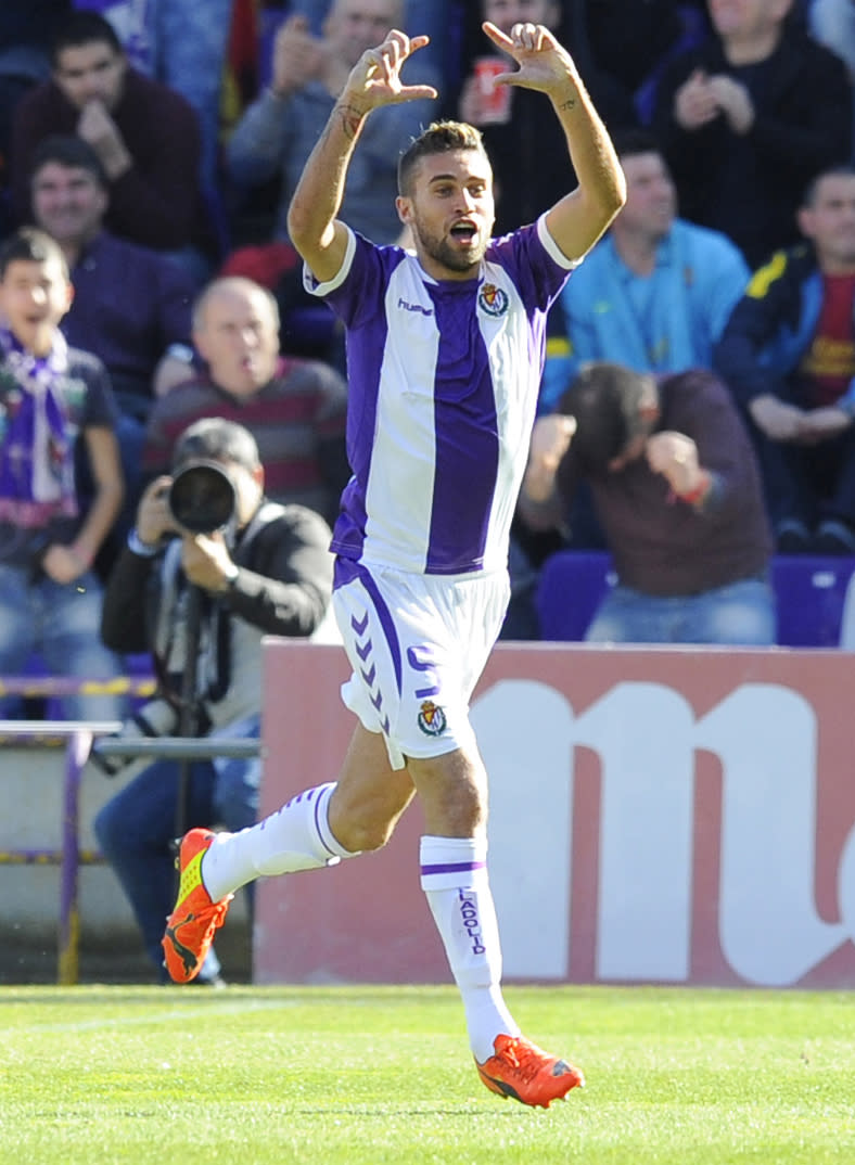 Valladolid's Italian midfielder Fausto Rossi celebrates scoring during a Spanish La Liga soccer match against Barcelona at the Jose Zorrilla stadium in Valladolid, Spain on Saturday March 8, 2014. (AP Photo/Israel L. Murillo)